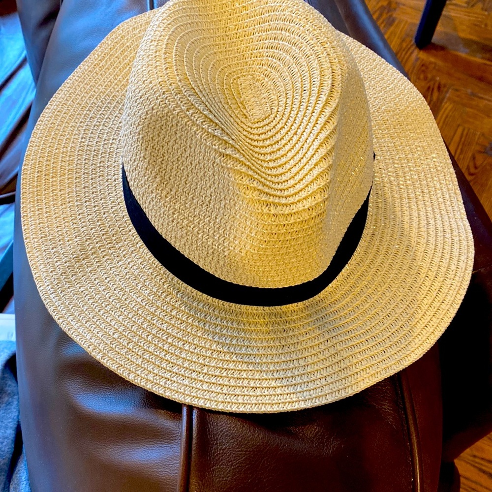 Straw hat with black trim. Never worn! Brand new!!